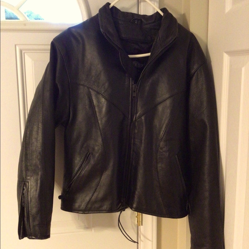 Women’s size Large leather jacket with lining.